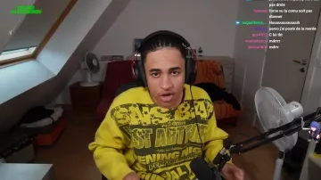 The yellow SNS sweater worn by Paltay in the YouTube video Every time I laugh, I lose 200 euros