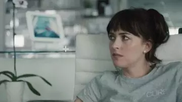 Dakota Johnson's Outfits: As Lucy in Am i OK? movie, she is wearing a "Cure" Grey Tee