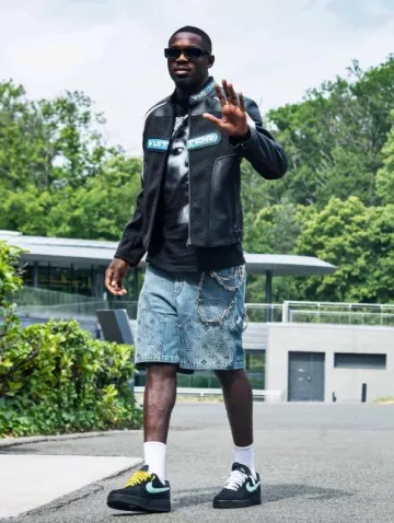 Prada Black & White Trim Symbole Sunglasses worn by Marcus Thuram on the Instagram account @footballerfits