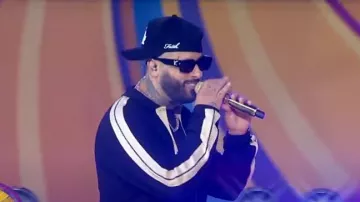 Palm Angels Monogram Linen Button-Up Polo Track Shirt worn by Nicky Jam as seen in Good Morning America on August 11, 2024