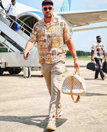Bottega Veneta Gold & Brown Metal Pilot Sunglasses worn by Travis Kelce on the Instagram account @chiefs