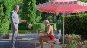 Celine Triomphe Flared Track Pants worn by Zeus (Jeff Goldblum) in KAOS (S01E02)