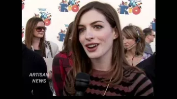 Love by Design Brown and Black Crop Sweater worn by Anne Hathaway for the world premiere of 'Rio' Movie on April 10, 2011 in Los Angeles