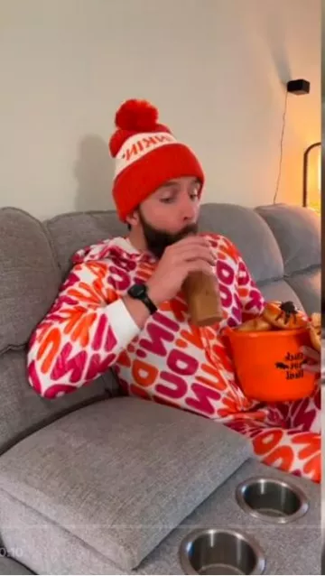 Ian Brownhill wears Dunkin Donuts Onesie on his Tiktok account