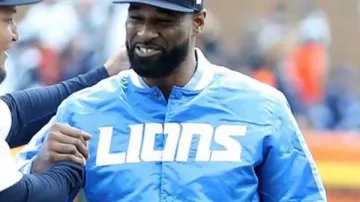 Calvin Johnson wears Detroit Lions Blue Satin Varsity Jacket
