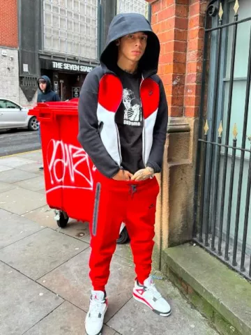 Nike Black Red White Windrunner Zip Hoodie worn by Central Cee on the Instagram account @centralcee