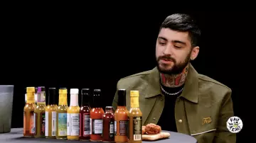 Zayn Malik is wearing Fetti Trench Denim Jacket in olive green in Hot Ones