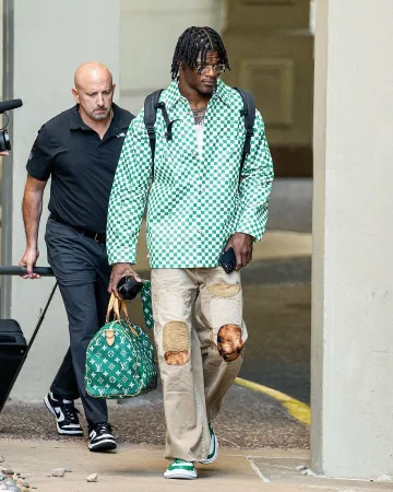 Kapital Beige Patches Katsuragi Port Pants worn by Lamar Jackson on the Instagram account @lamarjacksonentertainment