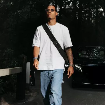 Bottega Veneta Black Padded Cassette Messenger Bag worn by Virgil van Dijk on the Instagram account @virgilvandijk