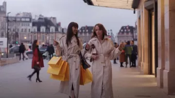 Jacquemus Beige Les Classiques 'Le trench Bari' Trench Coat worn by Sylvie Grateau (Philippine Leroy-Beaulieu) as seen in Emily in Paris (S04E07)