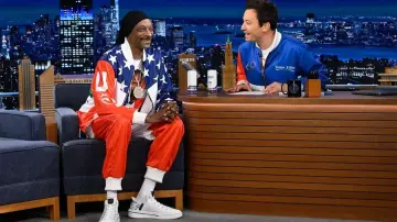 Snoop Dogg is wearing Team USA Olympics tracksuit at The Tonight Show Star­ring Jim­my Fal­lon on May 13, 2024
