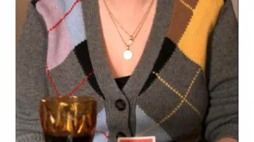 Outfits from Only Murders in the Building: Selena Gomez wears Grey Argyle Cardigan to portra Mabel Mora in season 4, episode 2