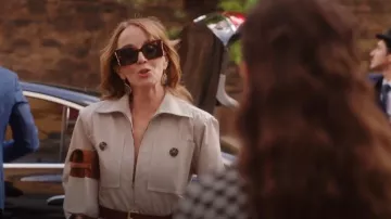 Saint Laurent Manhattan Leather And Canvas Shoulder Bag worn by Sylvie Grateau (Philippine Leroy-Beaulieu) as seen in Emily in Paris (S04E09)