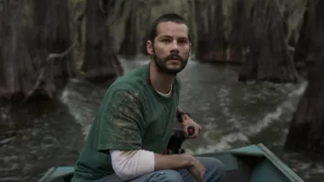 Caddo Lake Movie Outfits: Dylan O'Brien is wearing Green T-shirt in the thriller produced by M. Night Shyamalan