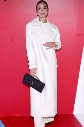 Bottega Veneta Andiamo Clutch worn by Olivia Culpo on her Instagram Story on September 7, 2024