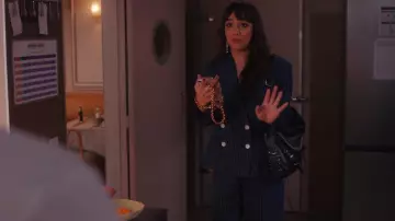 Givenchy Voyou Medium Leather Shoulder Bag worn by Geneviève (Thalia Besson) as seen in Emily in Paris (S04E10)