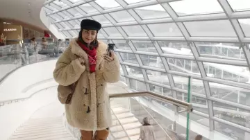 Outfits of Emily In Paris Season 4: Emily Cooper (Lily Collins) is wearing Shearling Jacket in episode 6