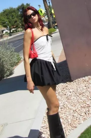 Alaia Le Teckel Small Bag in Red worn by Dua Lipa on her Instagram Story on September 24, 2024