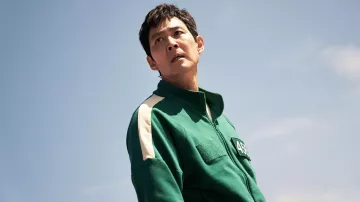 Costumes of Squid Game Season 2: Seong Gi-hun (Lee Jung-jae) wears Player Sweat pants and jacket in green with number "456"