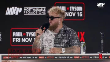 Jake Paul wears Prada Two Tone white and black shirt at the Jake Paul vs. Mike Tyson: Press Conference at FanaticsFest live on Sunday, August 18, 2024