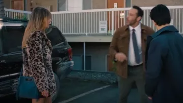 Maje Navy Mini M Tassel-Trimmed Suede Shoulder Bag worn by Morgan (Kaitlin Olson) as seen in High Potential (S01E01)