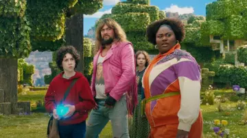 A Minecraft Movie Outfits: Jason Momoa wears Pink Fringe Leather Jacket to portray Garett Garrison
