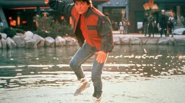 Costumes of Back to the Future Part II: Marty McFly (Michael J. Fox) wears Iconic Nike Air Mag futuristic sneakers