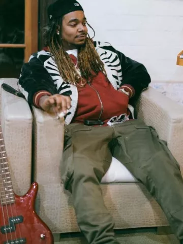 Amiri Olive Green Tactical Cargo Pants worn by Wheezy on the Instagram account @wheezy