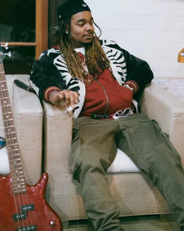 Black Velour Skeleton Bomber Jacket worn by Wheezy on the Instagram account @wheezy