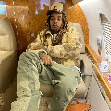 Cactus Jack Beige Abstract Sherpa Fleece worn by Wheezy on the Instagram account @wheezy