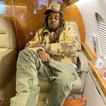 Cactus Jack Beige Abstract Sherpa Fleece worn by Wheezy on the Instagram account @wheezy