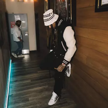 Amiri Ivory Crochet Bucket Hat worn by Wheezy on the Instagram account @wheezy