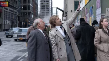 The Apprentice Movie Outfits: Sebastian Stan wears Gray Trench Coat to portray Donald Trump in the biopic