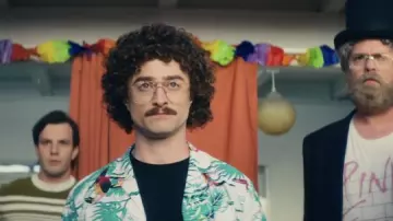 Outfits of Weird: The Al Yankovic Story: Daniel Radcliffe wears Oversize Eyeglasses to portray 'Weird Al' Yankovic in the movie