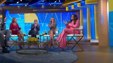 Christian Louboutin Sandaloo Metallic Peep Toe Sandal in Silver worn by Niecy Nash as seen in Good Morning America on September 25, 2024