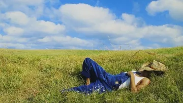 Bob Sinclar wears blue overalls on the cover of the Western Dream album