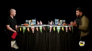 Cam Heyward is wearing Olive Green jacket in Hot Ones TV show