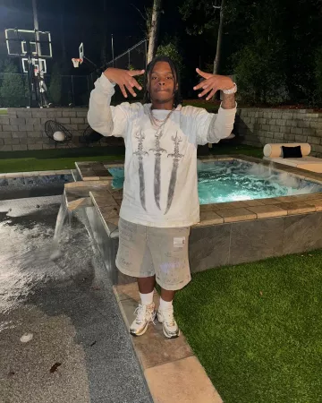 Maison Mihara Yasuhiro Faded Grey Alien Print Sweatshorts worn by 42 Dugg on the Instagram account @42_dugggg