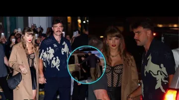 Travis Kelce wears navy blue printed short sleeve shirt by Jacquemus dating Taylor Swift for dinner on October 11, 2024 in New York City
