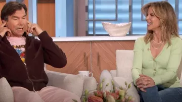 Staud Cargo Ribbed Cardigan in Matcha worn by Natalie Morales as seen in The Talk on October 11, 2024