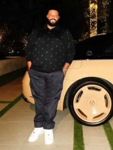 Pantalones cargo Louis Vuitton x America's Cup Navy usados por DJ Khaled en la cuenta de Instagram @djkhaled
