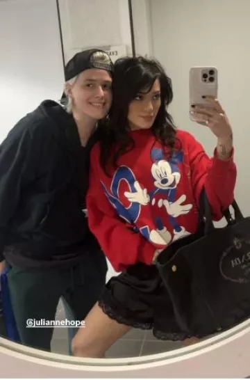 Urban Sophistication The Puffer Case in Strawberry Frozen Yogurt worn by Niki DeMartino on her Instagram Story on October 3, 2024