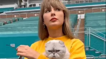 Taylor Swift wears a yellow sweatshirt during her Reels on Instagram in empty stadium of Miami on Eras Tour 2024