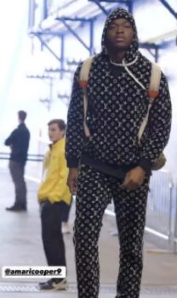Sac à dos cargo Gucci x The North Face Beige GG & Orange porté par Amari Cooper sur le compte Instagram @houstontexans