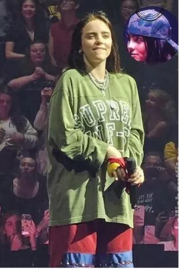 Nike Reversible Basketball Shorts in Maroon worn by Billie Eilish at Detroit Concert on October 7, 2024