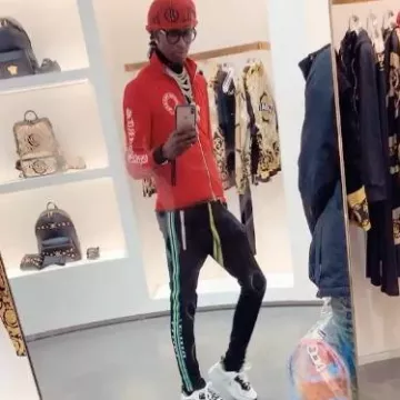 Pantalon de survêtement Amiri Black & Neon Blue Stripe porté par Young Thug sur le compte Instagram @young.thug.world