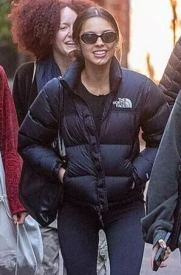 Reformation Clara Cashmere Crew Cardigan In Black worn by  Olivia Rodrigo in Melbourne on October 8, 2024