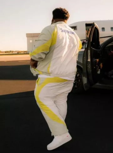 Supreme White & Yellow Soccer Trackpants worn by Rod Wave on the Instagram account @rodwave