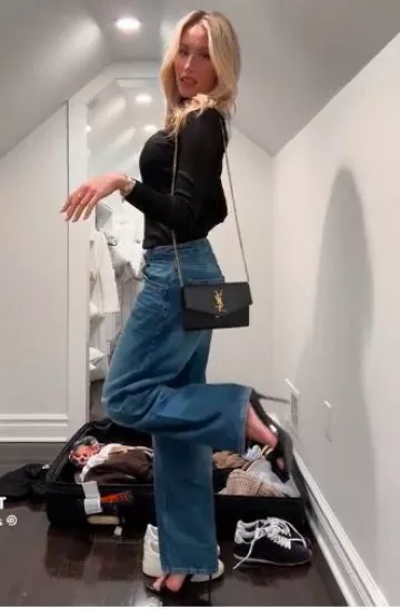Saint Laurent Uptown Chain Wallet In Grain De Poudre Embossed Leather worn by Alix Earle on her Tiktok on October 10, 2024