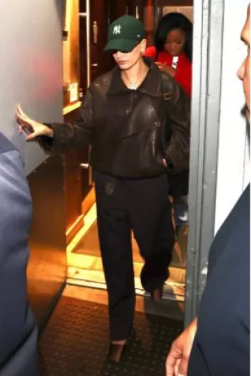 Saint Laurent 557 Sunglasses in Black worn by Hailey Bieber at Sushi on October 9, 2024